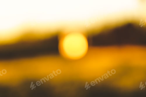 Preview: Blurred background with yellowish sunrise colours