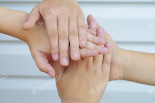 Preview: Children hold hands as a sign of friendship and unity