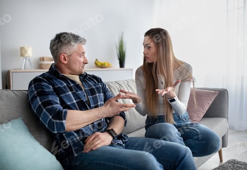 Preview: Frustrated mature couple quarreling at home, being angry, facing family problems