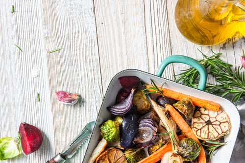 Preview: Roasted root vegetables with herbs on wooden table