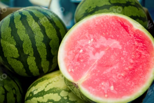 Preview: close up view of half of watermelon and watermelons