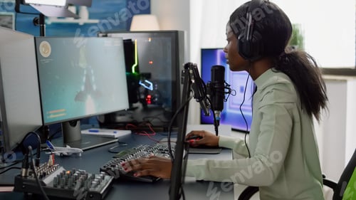 Preview: Competitive black gamer with headphones using stream chat