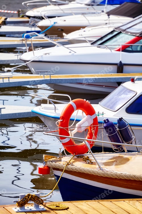 Preview: Marina with moored yachts and motorboats.