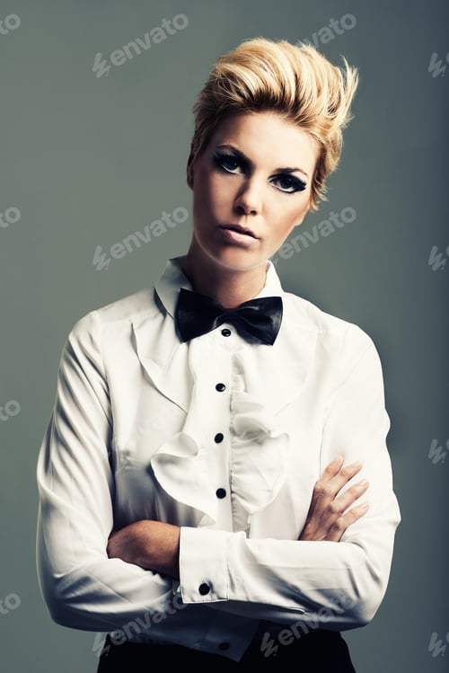 Preview: Twiggy would be proud. Portrait of a young woman with quirky style looking at the camera.