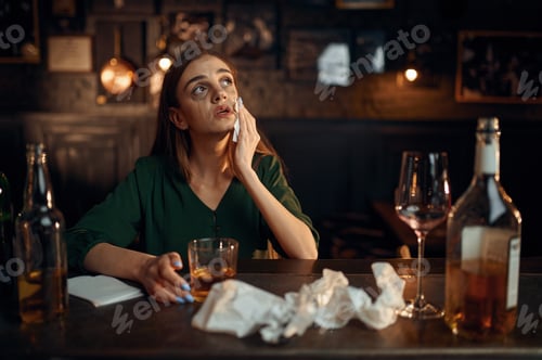 Preview: Drunk depressed woman at the counter in bar