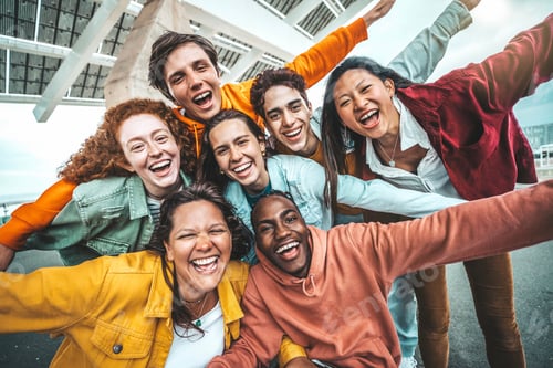 Preview: Multicultural young people smiling at camera together outside