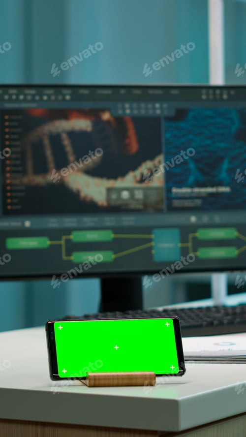 Preview: Scientist using smartphone with green screen placed on desk