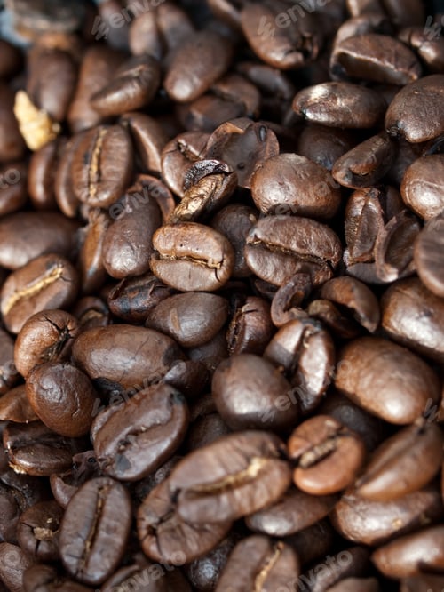 Preview: Vertical shot of many coffee beans mixed with each other