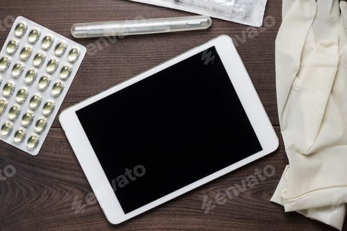 Preview: Table With Tablet Computer Pills And Gloves On It