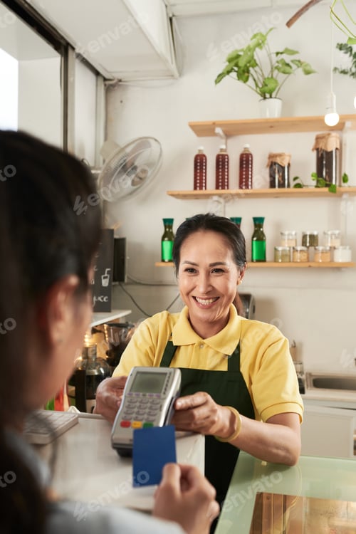 Preview: Cafe Worker Accepting Payment
