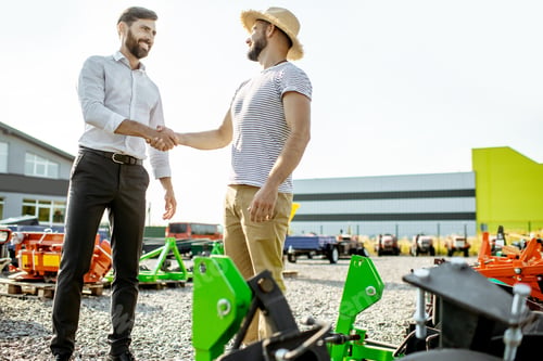 Preview: Agronomist with salesman at the agricultural shop