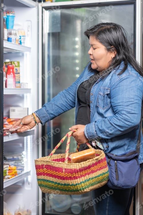 Preview: Fat woman buying cured meats in a supermarket
