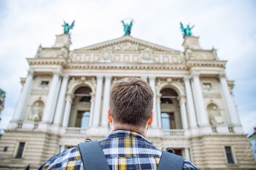 Preview: Tourist Man Look At Old European Architecture. Copy Space. Travel Concept