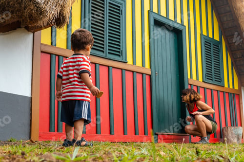 Preview: Mother and son playing in a traditional Madeiran house like the ones in Santana in the forest of