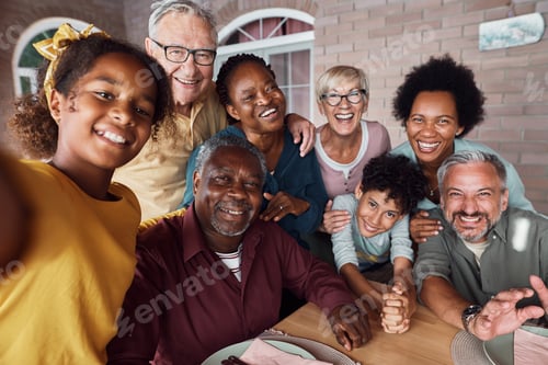 Preview: Happy multiracial extended family having fun while taking selfie on a patio.