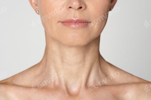 Preview: Cropped of a Womans Neck and Chin