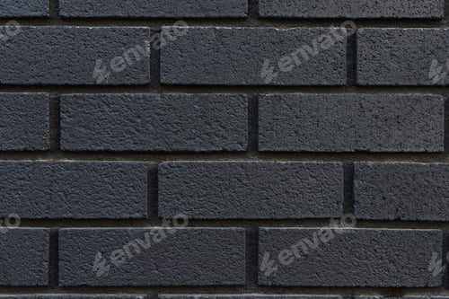 Preview: Black brick wall texture background close-up.