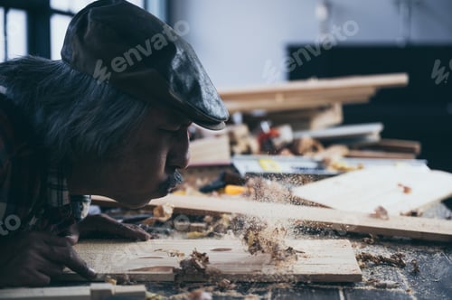 Preview: old carpenter man, wooden craftsman working with wood