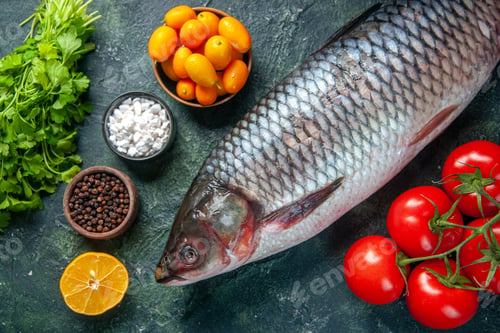 Preview: top view fresh raw fish with greens and tomatoes on dark background food health water fish color
