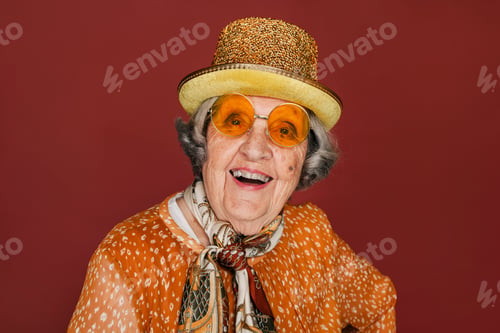Preview: Smiling elderly grandmother posing at studio