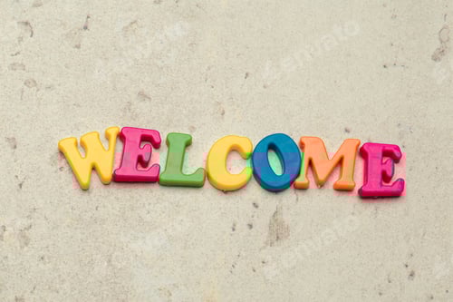Preview: Word Welcome written in colorful plastic letters close up shot