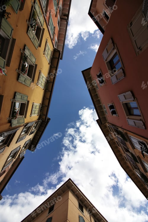 Preview: Low angle shot from a narrow street on residential buildings in Gardasee, Italy.