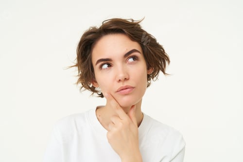 Preview: Close up portrait of woman with thoughtful face, thinking of solution, pondering, making choice