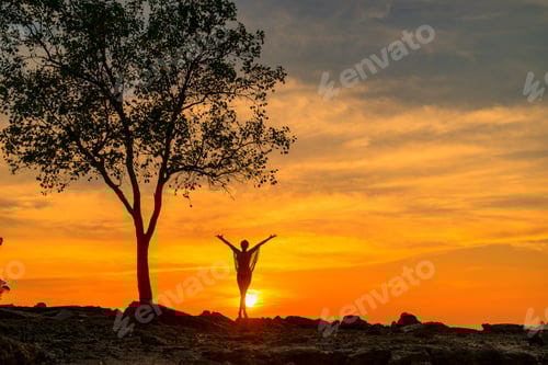 Preview: Beautiful Woman at the beach in Thailand at sunset