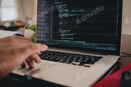 Preview: African American man sitting in front of computer coding, programming, web developer
