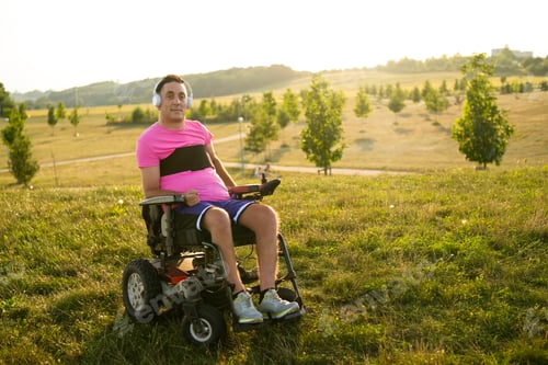 Preview: Wheelchair user listening to favorite music outdoors