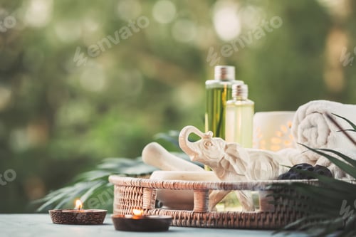 Preview: Beautiful composition with natural cosmetic, towels and burning candles.