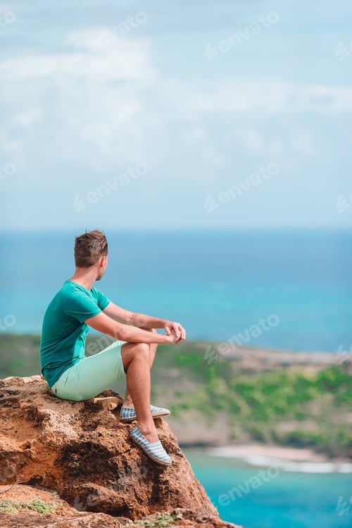 Preview: Young man enjoying breathtaking views of beautiful landscape