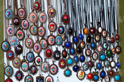 Preview: Antique medallions on the window of a flea market .