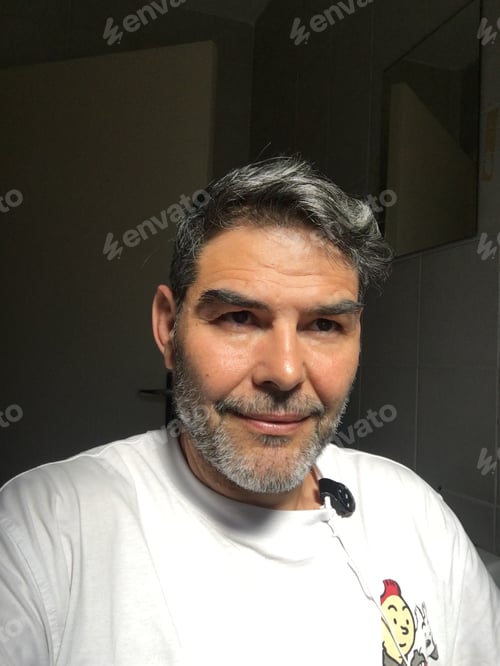 Preview: A handsome middle aged man smiling wearing a white cotton t-shirt