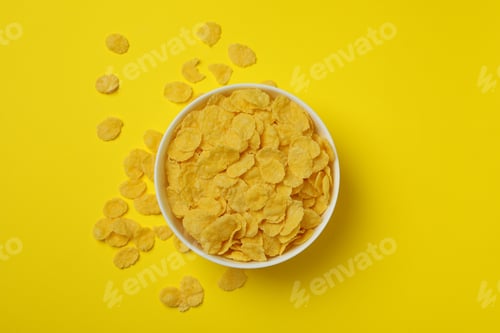 Preview: Bowl of corn flakes on yellow background