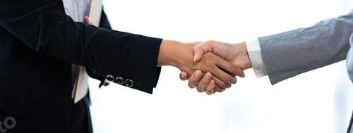 Preview: Business people shaking hands after joining a good business dealing in the office. Collaborative tea