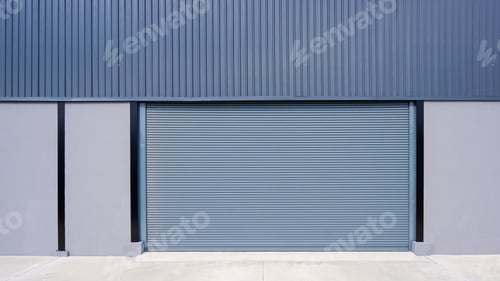 Preview: Automatic roller shutter door on concrete and corrugated metal wall of new modern warehouse building