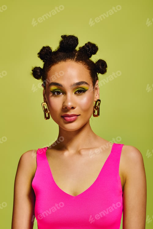 Preview: Vibrant young woman showcases bold fashion and unique beauty against a lively green backdrop