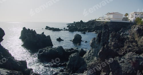 Preview: Alcala, Tenerife, Spain. Rocky volcanic shore, sunset in perfect place for travel and rest.