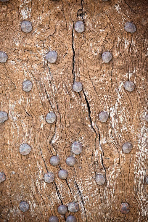 Preview: Wooden surface with old metal rivets background