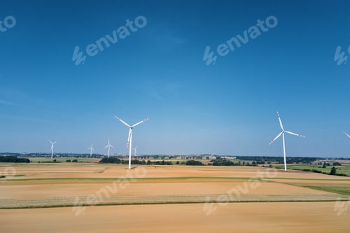 Preview: Windmill turbine in the field at summer day. Rotating wind generator