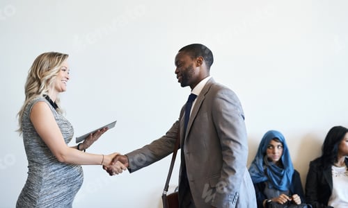 Preview: Shot of a well-dressed candidate shaking hands with his interviewer before an interview