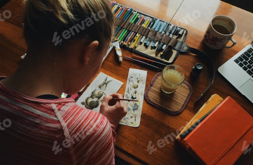 Preview: female artist painter painting a picture of a easter bunny