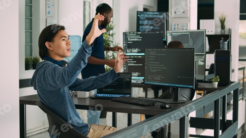 Preview: Asian web developer working with hologram and augmented reality