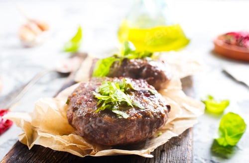Preview: Juicy Hamburger Patties with Fresh Green Herbs