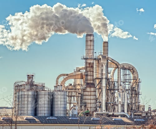 Preview: Chimneys and silos of a factory.