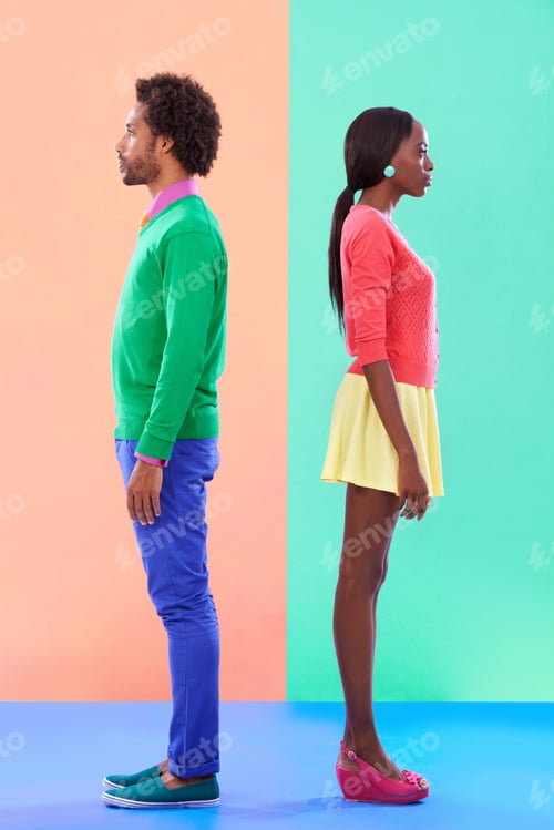 Preview: Studio shot of a young couple standing against a colourful background
