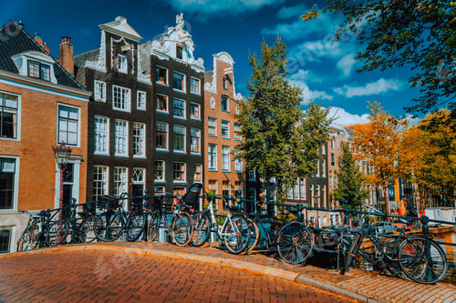 Preview: Traditional Dutch style houses in Amsterdam, Netherlands. Vibrant autumn day