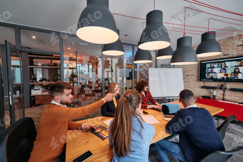 Preview: A diverse team of business professionals engage in discussions on various projects and develop new