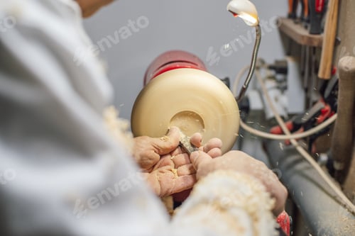 Preview: Cabinetmaker shaping a piece of wood on the lathe